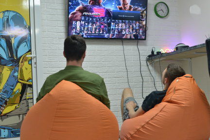 two people are playing game console